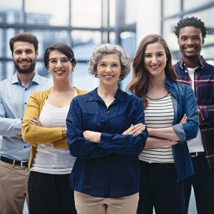 group of happy managers with arms crossed